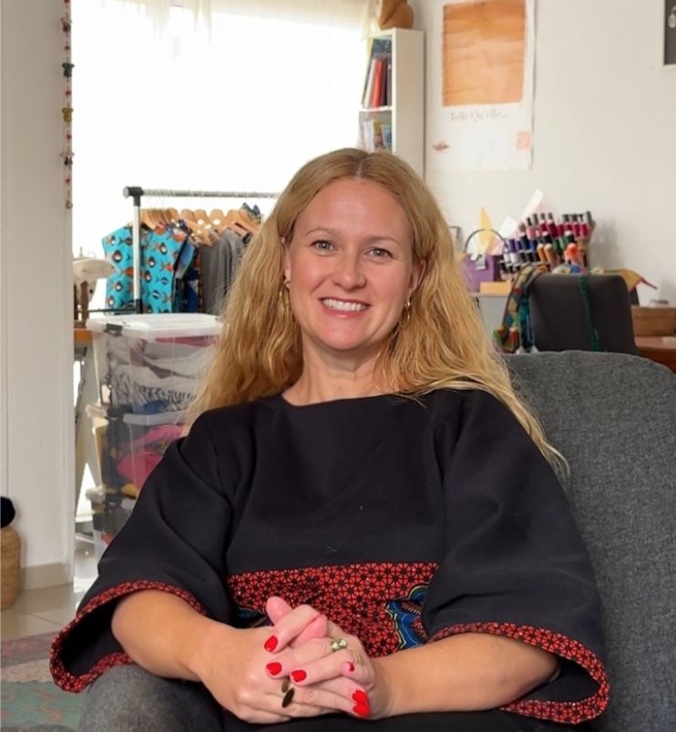 Elvire at her market stall with handmade pieces